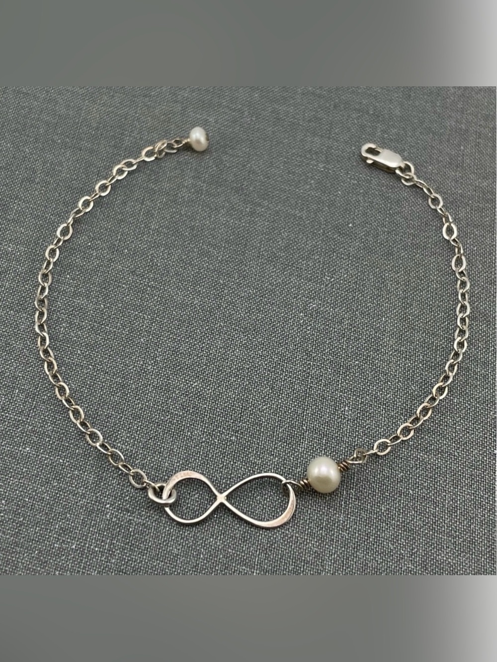 Elegant Sterling Silver Infinity Bracelet with Freshwater Pearl Accent